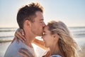 Love, dating and couple kiss at beach enjoying romantic holiday, vacation and honeymoon by ocean. Happiness, summer and Royalty Free Stock Photo