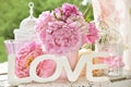 Love decoration with wooden letters and peony flowers with color Royalty Free Stock Photo