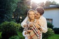 Delighted nice positive man hugging his girlfriend Royalty Free Stock Photo