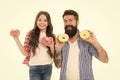 We love donuts. Fathers day present. Perfect for dads with sweet tooth. Girl child and dad hold colorful glazed donuts Royalty Free Stock Photo