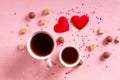 Love drinks. Coffee tea cups for lovers, sweets candy chocolate on pink hearts background. Valentines day 14 february Royalty Free Stock Photo