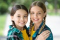 Love each other. Two young smiling hipster girls in trendy summer clothes. carefree kids posing outdoor. Positive models Royalty Free Stock Photo