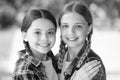 love each other. Two young smiling hipster girls in trendy summer clothes. carefree kids posing outdoor. Positive models Royalty Free Stock Photo