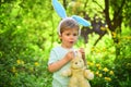 Love easter. Family holiday. Egg hunt on spring holiday. Happy easter. Childhood. Little boy child in green forest Royalty Free Stock Photo