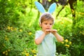 Love easter. Family holiday. Little boy child in green forest. Egg hunt on spring holiday. Happy easter. Childhood Royalty Free Stock Photo