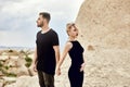 In love Eastern couple in mountains of Cappadocia hugs and kisses. Love and emotions loving couple vacationing in Turkey. Closeup