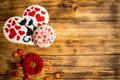 Love famaly card, sugar cake, red flowers wooden table Royalty Free Stock Photo