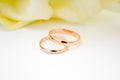 love, family, celebration, ceremony concept -wedding symbols two golden rings with callas white flowers Royalty Free Stock Photo