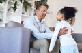 Love, family and father lifting girl in home living room, having fun and bonding together. Care, smile and happy man Royalty Free Stock Photo