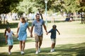 For the love of family. a happy young family going for a walk in the park.