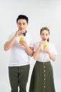 Love, family, healthy food and happiness concept - smiling happy couple drinking juice on white background Royalty Free Stock Photo