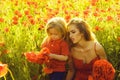 Love and family, mother and child in poppy field Royalty Free Stock Photo