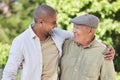 Love, father and adult son outdoor, hug and happiness with bonding, quality time and cheerful. Family, son and dad with Royalty Free Stock Photo