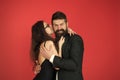 Love at first bite. Couple in love enjoy flirtation. Flirtation between sexy girl and bearded man. Flirtation and