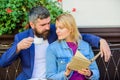 Love and flirt. Common interests. Couple in love sit cafe terrace. Man with beard and blonde woman cuddle on romantic Royalty Free Stock Photo