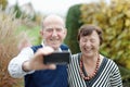 Love in focus. Happy senior couple bonding to each other and making selfie