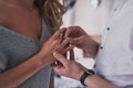 Love forever. Close up of young man taking on engagement ring on