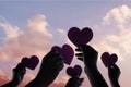 Love, Freedom and Charity Concept. Group of Diversity Volunteer People Raise Up Heart Paper Shape