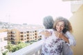 Love for friends or family concept with curly beautiful happy middle age woman hugging a mature grey hair senior lady on the Royalty Free Stock Photo