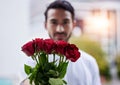 Love, giving and man with bouquet of roses for date, romance and hope for valentines day. Confession, romantic gift and