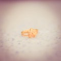 Love gold ring put on ground vintage style