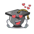 In love graduation hat mascot cartoon Royalty Free Stock Photo