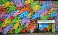 Love graffiti in Hanbury Street , Brick Lane, East London