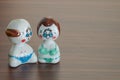 Love Grandfather and grandmother ceramic dolls on wooden table b