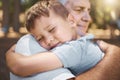 Love, grandfather and hug with child in park, woods or camping trip in nature with happy family quality time. Grandpa Royalty Free Stock Photo