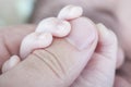 Love, Hand of newborn. Hands of father and son united. Maternity
