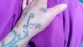 Love hand purple fingers tattoo