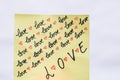 Love handwriting text close up isolated on yellow paper with copy space