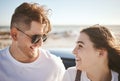 Love, happy couple on a beach holiday and smile with freedom on road trip in summer by ocean together. Loving man Royalty Free Stock Photo