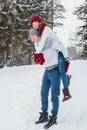 Love - Happy couple having fun smiling happy laughing together on romantic holidays. Young man giving piggyback ride to Royalty Free Stock Photo