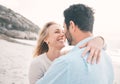 Love, happy and couple hug at beach for holiday, vacation and weekend getaway for anniversary. Travel, marriage and Royalty Free Stock Photo