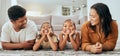 Love, happy family and lying relax on floor together in living room at home, bonding spend quality time and freedom Royalty Free Stock Photo