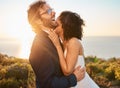 Love, happy and wedding with couple in nature for celebration, happiness and romance. Sunset, hug and affectionate with Royalty Free Stock Photo