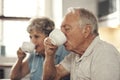 We love having tea together. a senior couple having breakfast together at home. Royalty Free Stock Photo
