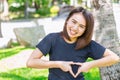 Love healthy concept Asian teen show hand heart sign