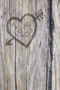 Love Heart And Arrow Graffiti Carved Into Wood