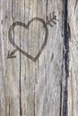 Love heart and arrow graffiti carved into wood Royalty Free Stock Photo