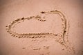Love heart in the beach sand Royalty Free Stock Photo