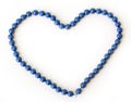 Love, heart. Blue necklace on a white background Royalty Free Stock Photo