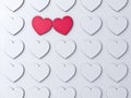 Love heart couple standing out from the crowd on white wall background with shadows Creative ideas and concepts