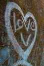 A love heart graffiti made by scrapping a concrete wall. India Royalty Free Stock Photo