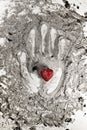 Love heart on hand print in ash Royalty Free Stock Photo
