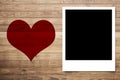 Love heart and Photo frame on Brown wood plank wall Royalty Free Stock Photo