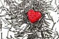 Love heart on pile of iron nails Royalty Free Stock Photo