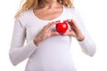 Love heart, protect and healthcare concept : Caucasian woman holding red heart on her chest and heart position isolated on white Royalty Free Stock Photo