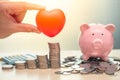 Love Heart and Saving Money Piggy Bank for Life insurance Royalty Free Stock Photo